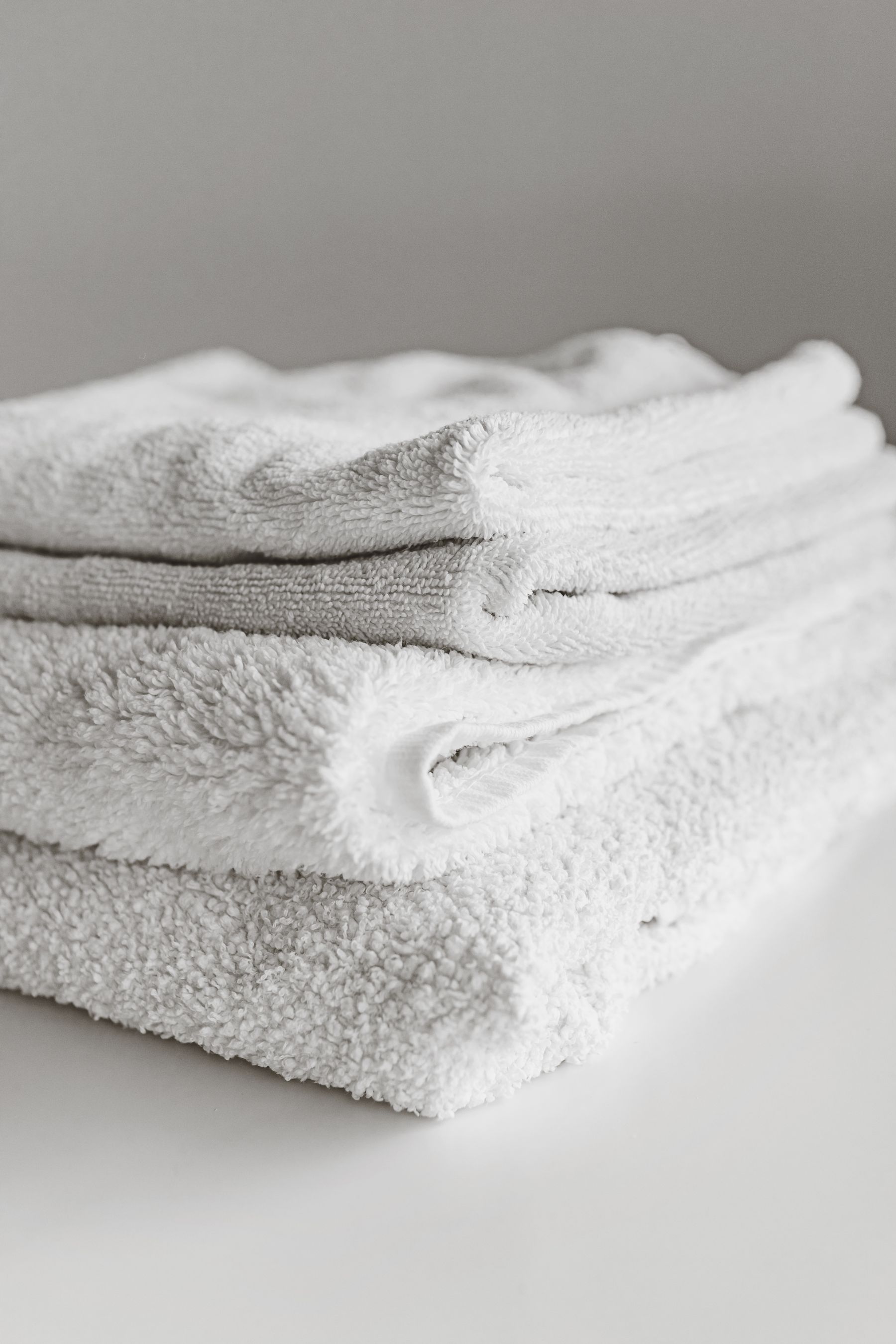 Stack of freshly cleaned and folded white spa towels